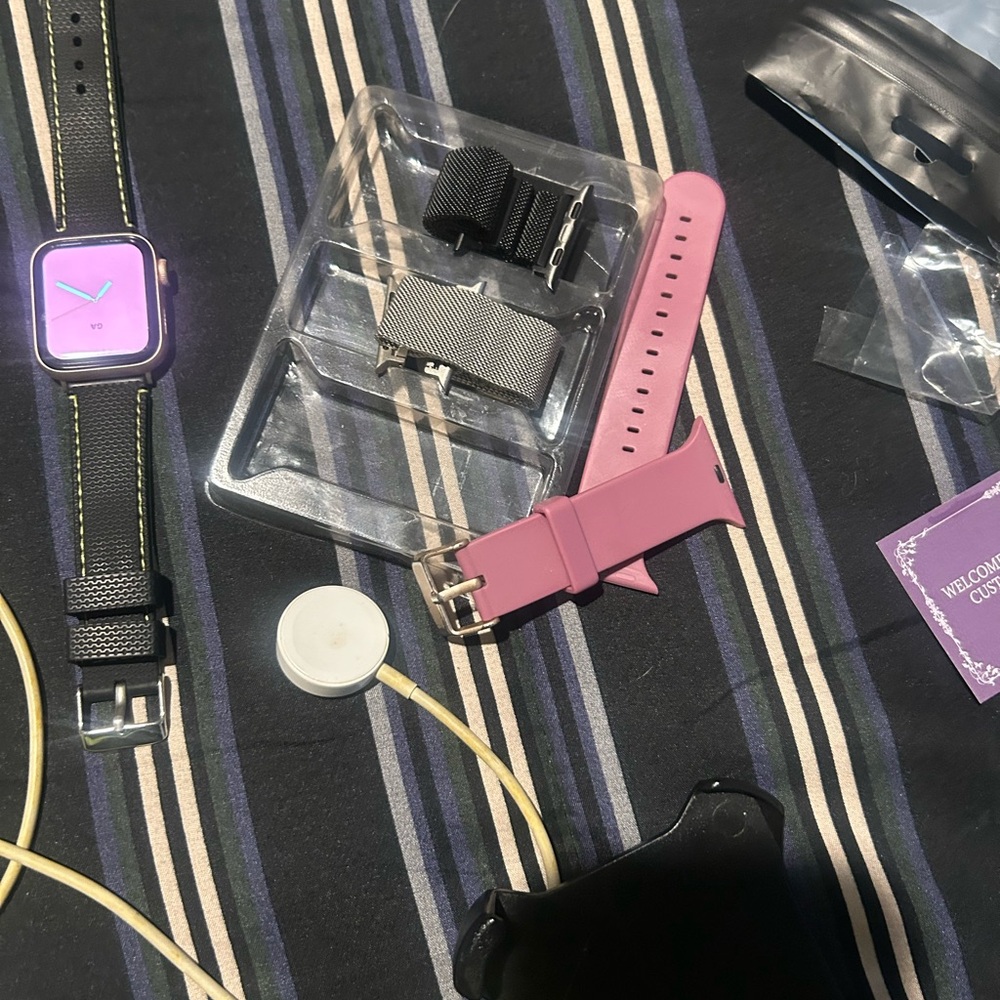 Purple Smartwatch with Pink and Black Straps